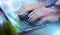 Hands typing on laptop keyboard; light effect Royalty Free Stock Photo