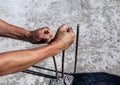 Male hands unbend reinforcement which sticks out of concrete Royalty Free Stock Photo