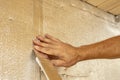 Male hands using aluminum tape to glue the joint foil insulation