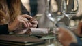 Male hands using mobile phone in cafe. Business couple using phone in restaurant Royalty Free Stock Photo