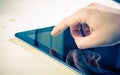 Male hands using tablet pc on wood table Royalty Free Stock Photo