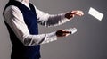 Male hands wasting money, cash, dollars. Male hands in formal wear throwing money on grey background.