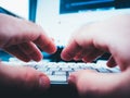 Male hands working on computer keyboard writing playing Royalty Free Stock Photo