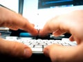 Male hands working on computer keyboard writing playing Royalty Free Stock Photo