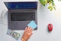 Male hands working on laptop, top view