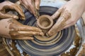 Male Hands Working with Lump of Clay on Potter`s Wheel Royalty Free Stock Photo