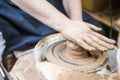 Male Hands Working with Lump of Clay on Potter`s Wheel in Workshop Royalty Free Stock Photo