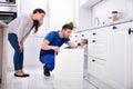 Male Handyman Installing Cabinet Door Royalty Free Stock Photo