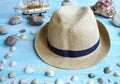 Male hat close-up, sea shells, sea stones. Travel and tourism. Summer vacation concept Royalty Free Stock Photo