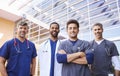 Male healthcare colleagues standing outdoors, low angle Royalty Free Stock Photo