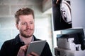 Male Heating Engineer Working On Central Heating Boiler Using Digital Tablet Royalty Free Stock Photo