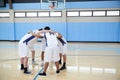 Male High School Basketball Players In Huddle Having Team Talk On Court Royalty Free Stock Photo