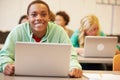 Male High School Student At Desk In Class Using Laptop Royalty Free Stock Photo