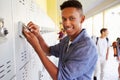 Male High School Student Opening Locker