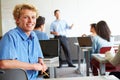 Male High School Student Using Laptop In Classroom Royalty Free Stock Photo