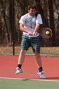 Male High School Tennis Player Hits Backhand