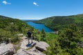 Male hiker enjoying the view of Jordan Pond in Acadia National Park