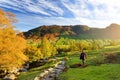 Male hiker exploring the Great Langdale valley in the Lake District, famous for its glacial ribbon lakes and rugged mountains Royalty Free Stock Photo