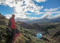 Male hiker hiking alone into the wild admiring volcanic landscape with heavy backpack. Travel lifestyle adventure wanderlust Royalty Free Stock Photo