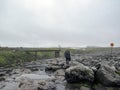 Male hiker hiking alone into the wild admiring volcanic landscape with heavy backpack. Travel lifestyle adventure wanderlust Royalty Free Stock Photo