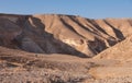 Male hiker on a hiking trail in a remote desert region.