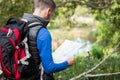 Male hiker looking at map Royalty Free Stock Photo