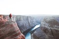 Male hiker overlooking Horseshoe Bend at sunset, Arizona, USA Royalty Free Stock Photo