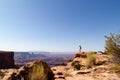 Male hiker standing on the edge of the canyon with Dead Horse Point district of Canyonlands in the background Utah, United States Royalty Free Stock Photo
