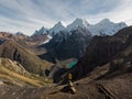 Male hiker in yellow jacket at Cordillera Huayhuash Circuit andes mountain San Antonio pass Laguna Jurau Huanuco Peru