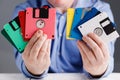 Male hold floppy disk in hands, retro storage