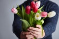 A Man holding bunch of tulips Royalty Free Stock Photo