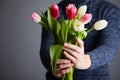 A Man holding bunch of tulips Royalty Free Stock Photo