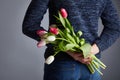 A Man holding bunch of tulips Royalty Free Stock Photo