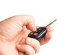 A male is holding a car key in his hand and pressing the alarm button. Close up Royalty Free Stock Photo