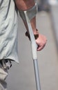 Male holding a crutch