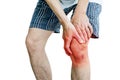 Male holding hand to spot of knee-aches