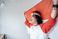 Male holding indonesian flag. patriotic nationalism concept