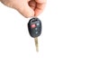 A dangling Toyota car key isolated on a white background. Royalty Free Stock Photo