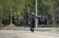 Male holding shovel and looking at sky Russia Berezniki 4 September 2017