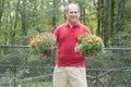 Male homeowner gardening flowers outdoors