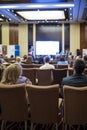 Male Host Speakers Standing in Front of the Audience During the Conference.