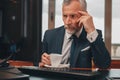 Male hotelier works at a computer while sitting in his office in a hotel Royalty Free Stock Photo