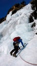 Male climber on a frozen waterfall near Pontresina in the Swiss Alps