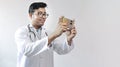 Male indian doctor in white coat and stethoscope clicking selfie with a mobile tripod and futuristic concept cameraphone Royalty Free Stock Photo