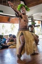 Male indigenous dancers entertain tourists