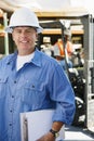 Male Industrial Worker Holding Clipboard