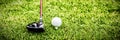 Male instructor assisting woman in learning golf