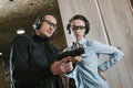 male instructor describing pistol to female client Royalty Free Stock Photo