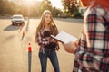 Male instructor and female student, driving school