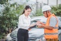 male insurance officer came to help inspect a customer's car that had an accident.